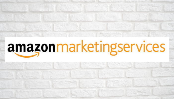 The logo of Amazon Marketing Services with a wall in the background